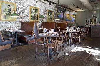 Interior: Local art lines the walls - Virginia's On King in Historic Downtown Charleston - Charleston, SC American Restaurants