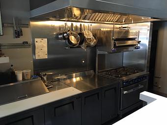 Interior: Small but efficient kitchen complete with range, broiler and hood - West Coast Wine • Cheese in Cow Hollow/Marina - San Francisco, CA American Restaurants