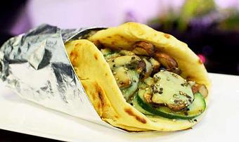 Product: This meatless gyro has mushrooms, spinach, tomatoes, cucumbers and sprouts with non-dairy homemade cucumber dill sauce. (Potential allergen warning: Cucumber dill sauce is made with coconut yogurt) - Alkalicious Cold Pressed Juice Bar in Greenbrier East - Chesapeake, VA Organic Restaurants