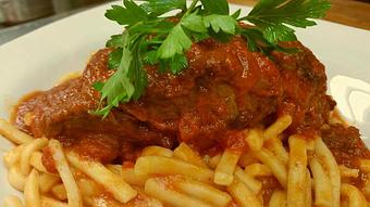 Product: Braised in a red sauce served over scialatelli pasta - Amore Ristorante in Woodland Park, NJ Italian Restaurants