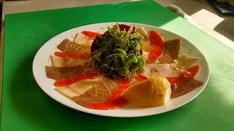 Product: Thinly sliced fresh salmon,swordfish,tuna,marinatedwith olive oil,lemon and dragoncelloherb,topped with seweed salad. - Art Caffe in Venice, FL Italian Restaurants