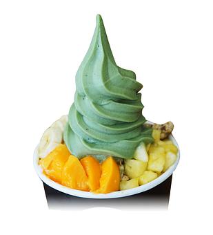 Product: Greens Banán (ginger, mint, spirulina, banana) topped with shaved coconut, granola, papaya, pineapple, banana, and honey - Banán - University Store in Honolulu, HI Vegan Restaurants