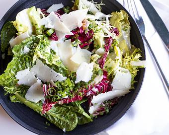 Product: Winter Greens Salad - Ketner Valley Farms winter greens mix, warm guanciale and sherry dressing, poached egg, herbs - Bello by Sandro Nardone in Newport Beach, CA Bars & Grills