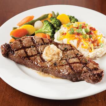 Product: Aged USDA Choice 12 oz. center cut strip, seasoned and grilled to your specifications. Topped with our signature steak butter. - Big Whiskey's American Restaurant & Bar in Ozark, MO American Restaurants