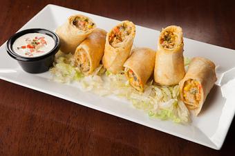 Product: Light and crisp egg rolls stuffed full with chicken, onions, cilantro and bell peppers. Served with Southwestern ranch. - Big Whiskey's American Restaurant & Bar in Ozark, MO American Restaurants
