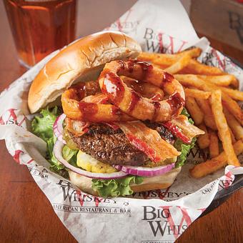 Product: Our biggest burger, piled high with crisp bacon, golden onion rings and smothered with our honey whiskey BBQ sauce. - Big Whiskey's American Restaurant & Bar in Springfield, MO American Restaurants
