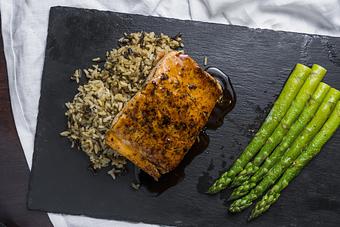 Product: Black rock signature recipe served with rice and fresh asparagus. - Black Rock Bar & Grill in Orlando, FL American Restaurants