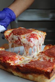 Product: Detroit-style pizza - cheese pull - Blue Pan Pizza in Congress Park - Denver, CO Dessert Restaurants