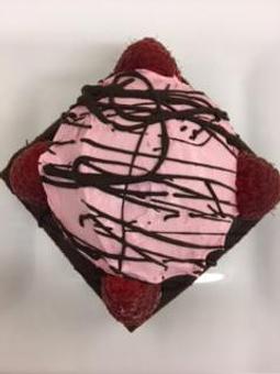 Product: Chocolate Tart with a raspberry crunch filling topped with a raspberry mousse and fresh raspberries. - Bon Appetit French Bakery and Cafe in Fort Walton Beach, FL Bakeries