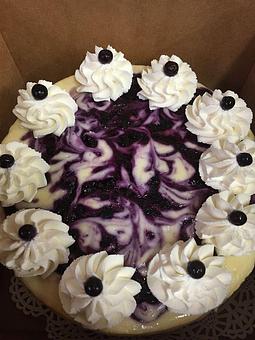 Product: Maine Blueberry Swirl Cheesecake - Botto’s Bakery in East Deering - Portland, ME Bakeries