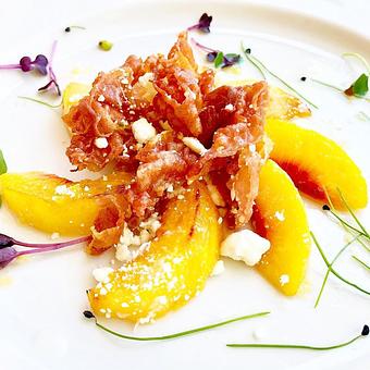 Product: Grilled peaches, prosciutto, honey goat cheese, white balsamic nectar - Braddock's in Medford, NJ American Restaurants