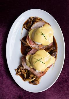 Product: Eggs Hussarde: A Brennan's Original - Housemade English Muffins, Coffee- Cured Canadian Bacon, Hollandaise, Marchand De Vin Sauce - Brennan's - Wine Cellar in French Quarter - New Orleans, LA Cajun & Creole Restaurant