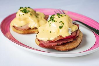 Product: Artisanal Eggs Benedict

Housemade English Muffins And Coffee-cured Canadian Bacon, Hollandaise - Brennan's - Wine Cellar in French Quarter - New Orleans, LA Cajun & Creole Restaurant