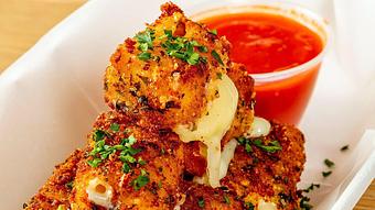 Product: Stack of crispy fried mozzarella served with a ramekin of marinara sauce - Bub City in Rosemont, IL Barbecue Restaurants
