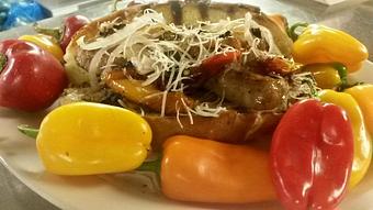 Product: Hot Italian sausage sub with garden yum yum peppers, pickled shallots, and aged parmesan cheese, - Buffleheads Restaurant At Hills Beach in Biddeford, ME American Restaurants