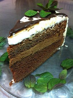 Product: Chocolate cake with chocolate mint ganash filling and mint buttercream frosting. - Buffleheads Restaurant At Hills Beach in Biddeford, ME American Restaurants