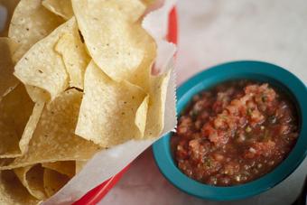 Product: Chips are fried in-house & served w/ Salsa Fresca, made in small batches w/ fresh tomatoes, serrano peppers, and onions - Chuy's in Katy, TX Mexican Restaurants