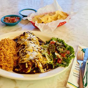 Product: A flour tortilla stuffed with refried beans, cheese & your choice of filling & topped with one of our Signature Sauces - Chuy's in Katy, TX Mexican Restaurants