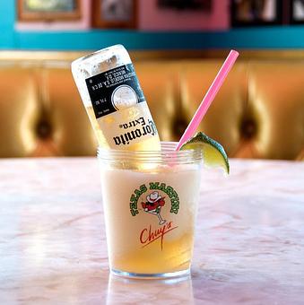 Product: The Chuy's Brew - frozen lime margarita topped with a 7oz. Coronita - Chuy's in College Station, TX Tex Mex Restaurants