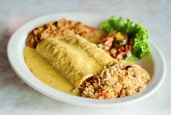 Product: A house favorite - Chicka-Chicka Boom-Boom Enchiladas stuffed w/ hand pulled chicken & topped with a spicy queso Boom-Boom sauce - Chuy's in College Station, TX Tex Mex Restaurants