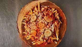 Product: Bed of fries topped with chicken, coleslaw, pickles and your choice of spice. - Cluck & Blaze in Glendale, CA American Restaurants
