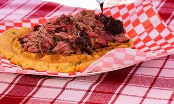 Product: Tender pulled pork with our tangy vinegar sauce drizzled with pure cane syrup. - Courson’s BBQ in Austin, TX Barbecue Restaurants