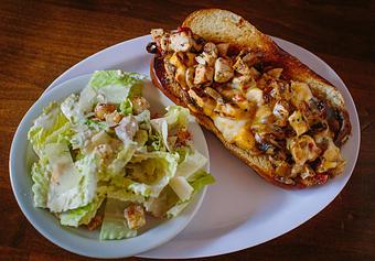 Product: This sandwich is a fan favorite. The soft, chewy pretzel bun is an "x-factor" - Crazy Horse Saloon & Grill in Nevada City, CA American Restaurants