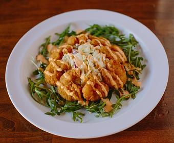 Product: This combination of zesty shrimp, tangy blue cheese slaw and fresh arugula is irresistible! - Crazy Horse Saloon & Grill in Nevada City, CA American Restaurants