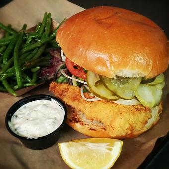 Product: Fried Catfish Sandwich topped with Lettuce, Tomato, Onion and Pickles served with Lemon and Homemade Tartar Sauce - Deep Run Roadhouse in West End - Richmond, VA Barbecue Restaurants