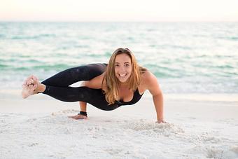 Product: Jac in an advanced arm balance - Destin Hot Yoga in Across the street from the Sandestin Outlet Mall - Miramar Beach, FL Yoga Instruction