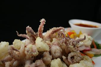 Product: flashed fried calamari with giardiniera, arugula with house-made marinara - Divani in Grand Rapids, MI American Restaurants
