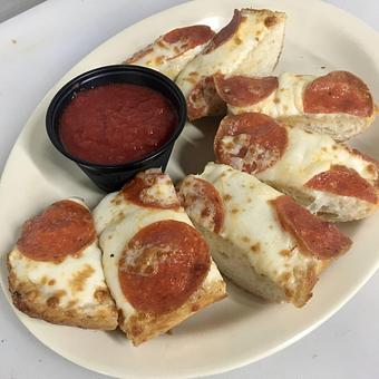 Product: Garlic Cheese Bread on our homemade hoagie rolls (with pepperoni added for $.50) - Dom Bakeries North Carolina in North Wilkesboro, NC Bakeries