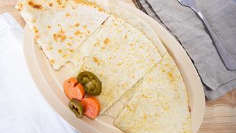 Product: 2 big flour tortillas filled with cheese and choice of meat - El Torito Restaurant & Meat Market in Hesperia, CA Mexican Restaurants