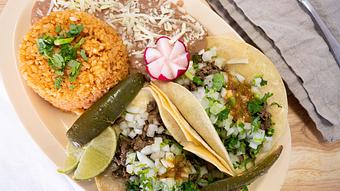 Product: Two Reg. Tacos plate served with choice of meat, rice & beans and choice of drink. - El Torito Restaurant & Meat Market in Hesperia, CA Mexican Restaurants