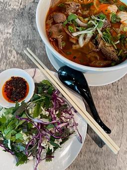 Product: Originated from the Vietnam Central region, this spicy beef noodle is a combination of thick vermicelli noodles and sliced beef brisket, shank, and Vietnamese bologna. - Eurasian Bistro in Argonaut Village - Pensacola, FL Vietnamese Restaurants