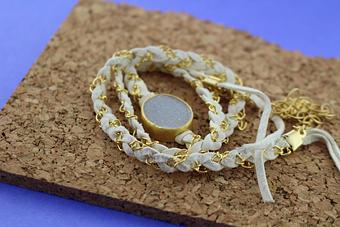 Product: The very popular wrap bracelet with white Druzy and leather and gold wrap. - Facet Foundry Jewelry Studio - Custom Jewelry Design Repair & Restoration. - We Buy Gold!-Work Done On Premises in Gastonia, NC Jewelry Stores