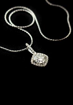 Product: Shimmering 18k Diamond Pendant with diamond bezel & bail -
center stone 1.00ct  with a total weight of 1.18. - Facet Foundry Jewelry Studio - Custom Jewelry Design Repair & Restoration. - We Buy Gold!-Work Done On Premises in Gastonia, NC Jewelry Stores