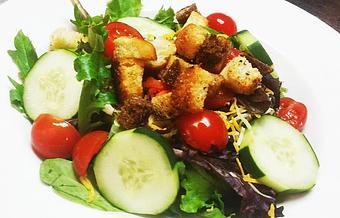 Product: Mixed greens, cheddar jack, cherry tomatoes, cucumbers, carrot, and seasoned croutons. 6.99

Add Grilled or Crispy Chicken 2.99
Add Shrimp or Tender Grilled Steak 3.99 - Finnegan's Grill in Ashburn, VA American Restaurants