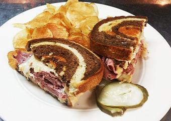 Product: First cut corned beef served on marble rye with sauerkraut,
Swiss cheese & house made thousand island dressing - Finnegan's Grill in Ashburn, VA American Restaurants