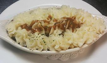 Product: Ground beef, carrots, peas, and onions in a rich Guinness gravy and topped with mashed potatoes. 12.59 - Finnegan's Grill in Ashburn, VA American Restaurants