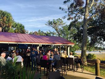 Product: View from the outside patio bar near the bocce court - Fishcamp On Broad Creek in Mid-Island - Hilton Head Island, SC Seafood Restaurants