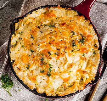 Product: An Alaskan-inspired Shepherd’s Pie. A healthy twist on a popular comfort food, made with Oregon Chinook salmon burger, russet potatoes, peas and carrots and Tillamook cheddar cheese. Suggested serving shown. - Fisherman's Market in Whiteaker - Eugene, OR Seafood Restaurants