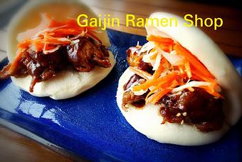 Product: Braised Tofu Buns - Served 2 Per Order
Braised chicken or tofu inside a steamed bao bun, topped with pickled vegetable medley, and a slathering of spicy mayo. Delicious! - Gaijin Ramen Shop in Arlington - Arlington, VA Pasta & Rice