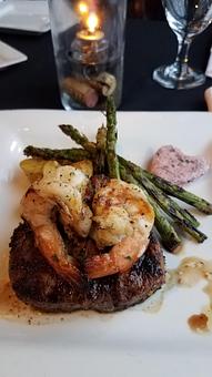 Product: 8 oz filet, topped with grilled jumbo shrimp with a side of beurre rouge sauce,
served with grilled asparagus & roasted potatoes - GIO Modern Italian in Chesterfield, MO Italian Restaurants