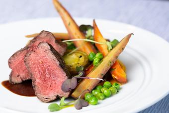Product: A hearty helping of perfectly cooked Double R Ranch tenderloin with sides. - Glitretind Restaurant in Deer Valley - Park City, UT American Restaurants