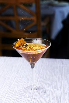 Product: Gold Medal Manhattan - our spin on a traditional Manhattan with actual gold flakes to top it off! - Glitretind Restaurant in Deer Valley - Park City, UT American Restaurants