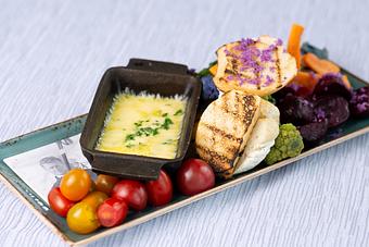 Product: Delicious raclette cheese with vegetable side - Glitretind Restaurant in Deer Valley - Park City, UT American Restaurants