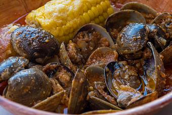 Product: Choose any one of our four flavors would be great with Manila Clams. - Hang Ten Boiler in Alameda, CA Cajun & Creole Restaurant