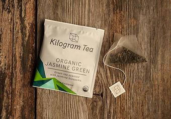 Product: An organic China green tea scented with jasmine blossoms in an amply sized pyramid bag to ensure that the flavors end up in the cup, not tossed out with the bag. - Harold's Coffee Lounge in Northwood - West Palm Beach, FL Coffee, Espresso & Tea House Restaurants