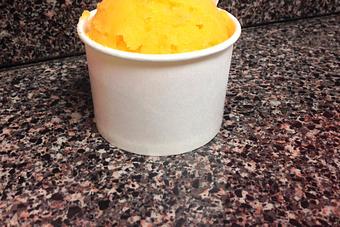Product: We add actually mango pieces to the Mango Italian Ice - Here's The Scoop Homemade Ice Cream and Italian Ices in Melbourne, FL Dessert Restaurants